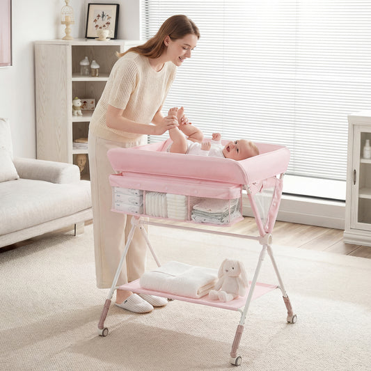 A woman changing a baby on the pink changing table in a nursery room