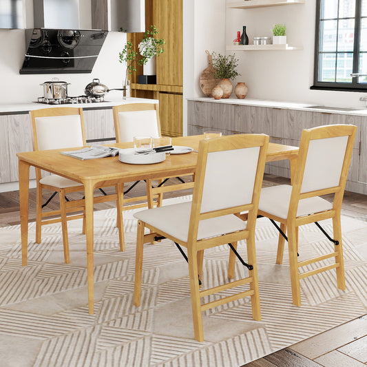 Four beige dining chairs around a wooden table in a modern kitchen setting