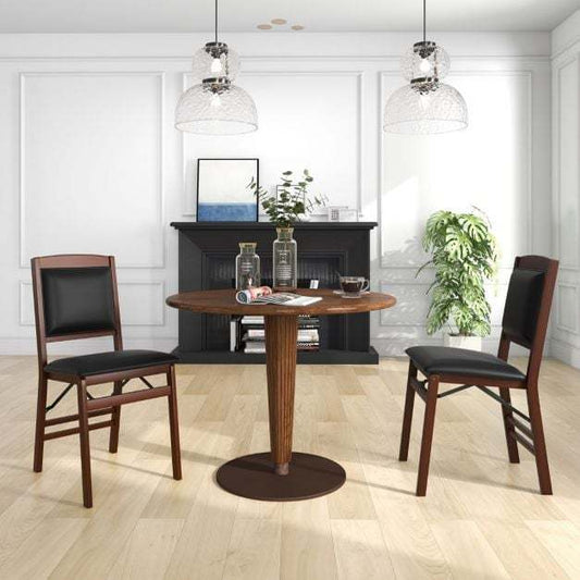 The dining chairs placed around a round wooden table in a bright modern dining room