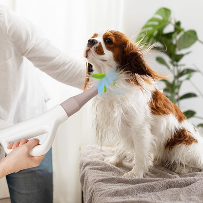 The dog hair dryer in use drying a wet dog on a towel
