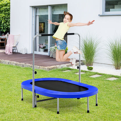 A young girl jumping on the blue fitness trampoline in a garden setting