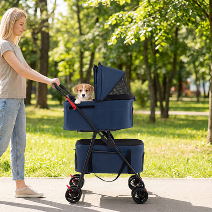 Woman pushing the blue double pet stroller with a dog in the top carrier in a park