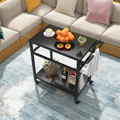 The black kitchen cart placed in a lounge area with fruit and drinks on top