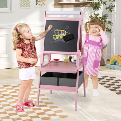 Pink art easel with a child drawing on the magnetic whiteboard side, with a second child watching