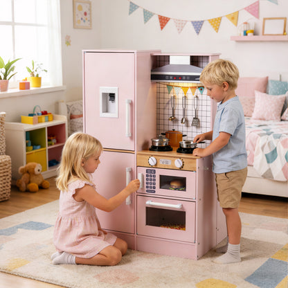 Two children play together at the pink dual-sided kitchen, one using the hob and the other the oven