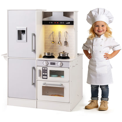 Child in chef outfit standing next to the play kitchen