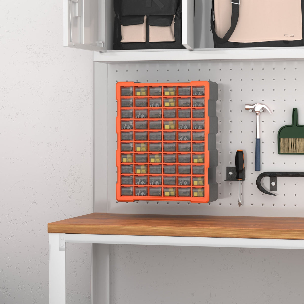 The parts organiser cabinet mounted on a pegboard wall above a workbench