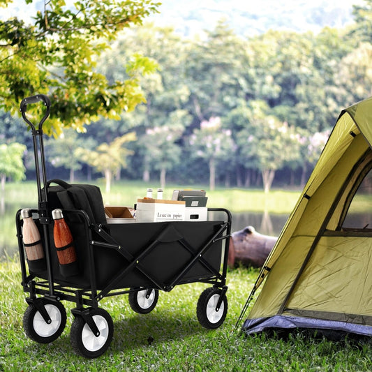 The camping garden cart is shown next to a tent by a lake in a grassy area