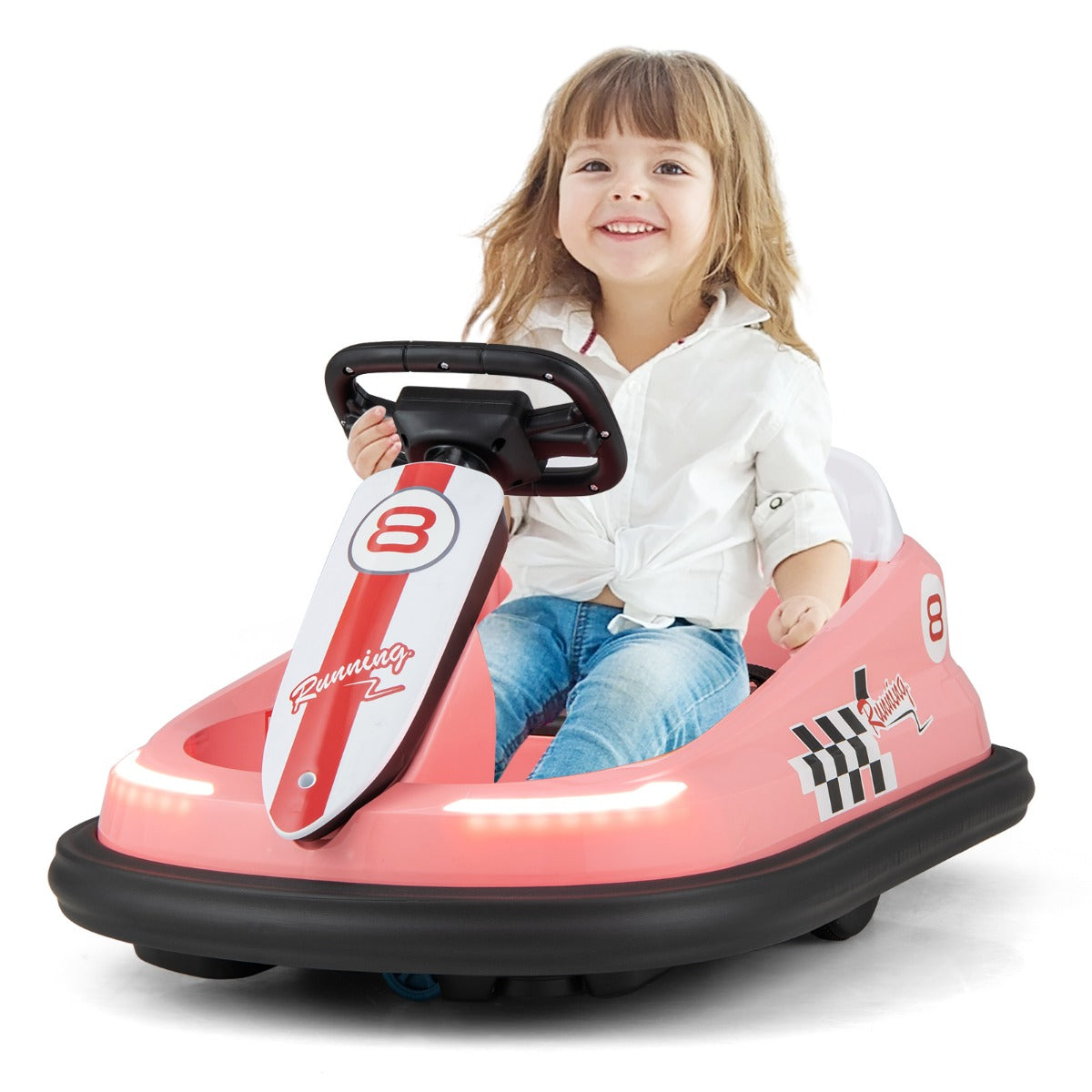 A happy child sitting in the pink kids electric car