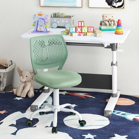 The kids chair is placed next to a white desk with toys and books on it