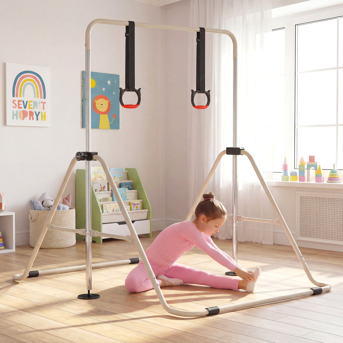 A girl in pink leggings sitting on the floor next to the gymnastic bar