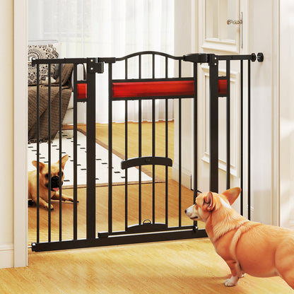 Two dogs interacting at the extra wide pet gate with a small door