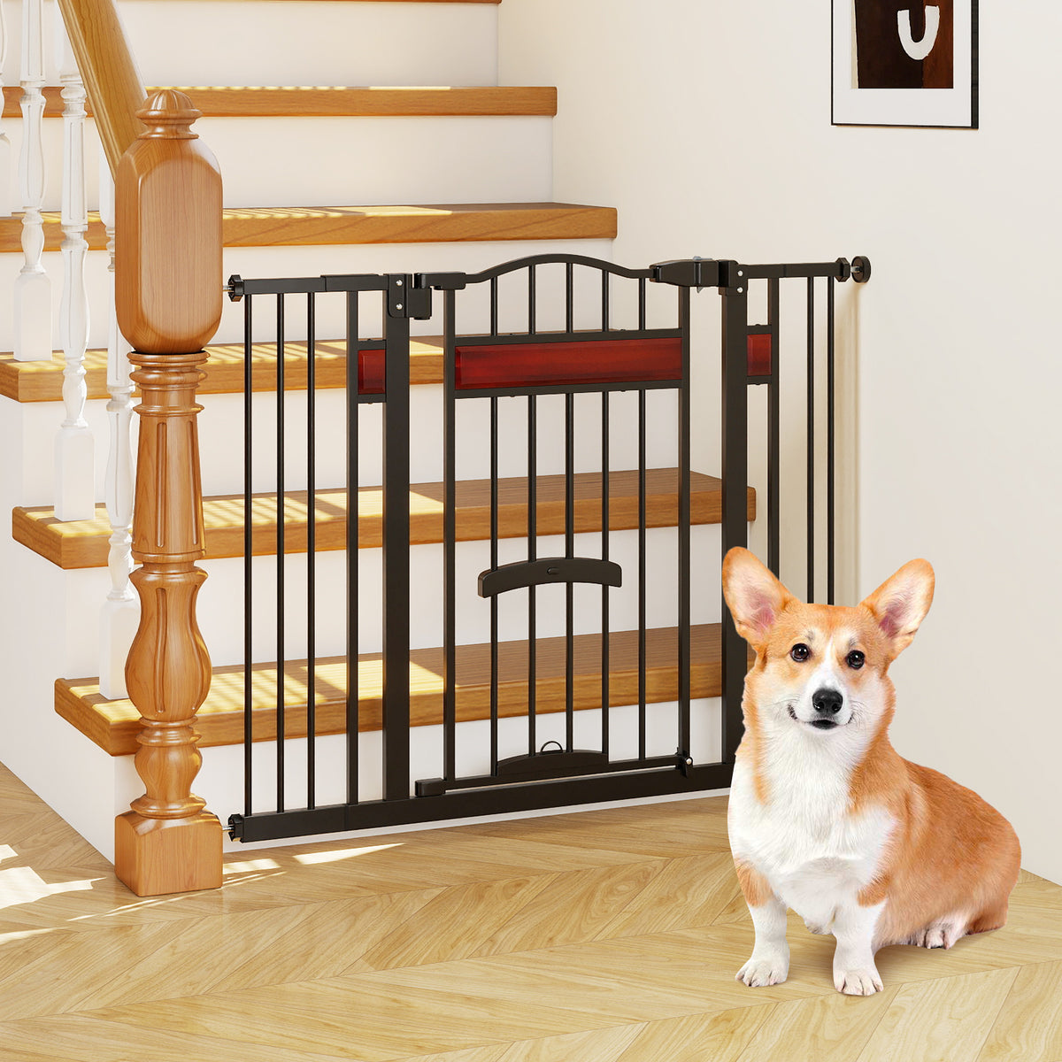 The extra wide pet gate installed at the bottom of a staircase with a corgi sitting in front
