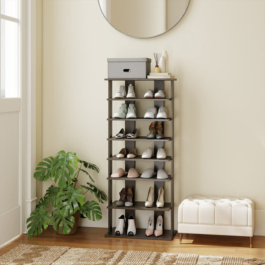 The shoe rack placed in a bright hallway next to a potted plant and a white upholstered bench