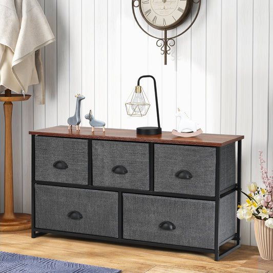 The fabric drawer cabinet is shown in a bedroom setting with a clock and decorative items