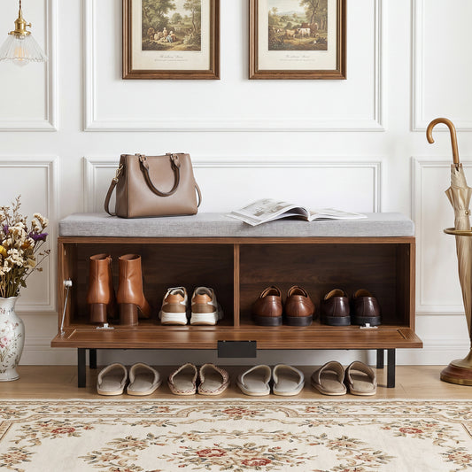 The shoe storage bench with padded cushion and rattan door, open to reveal two compartments for shoes
