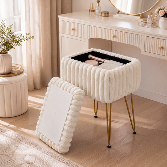 The beige ottoman with its lid open, showing storage inside, next to a dressing table