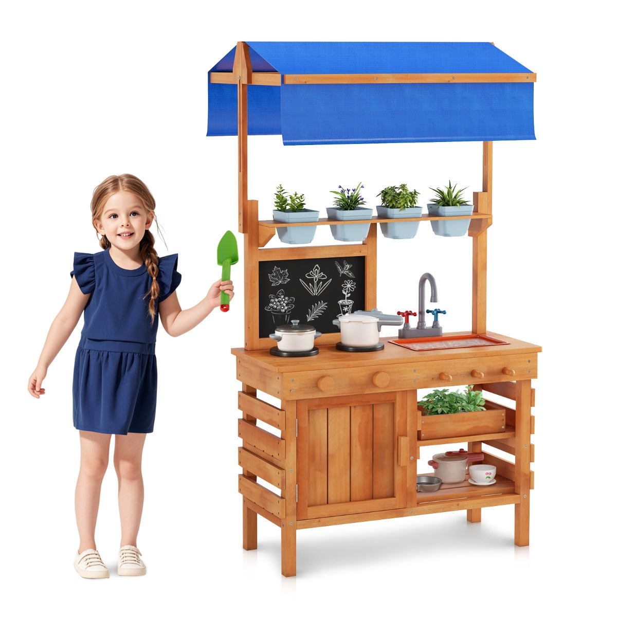 The play kitchen set on a plain white background with a young girl standing beside it