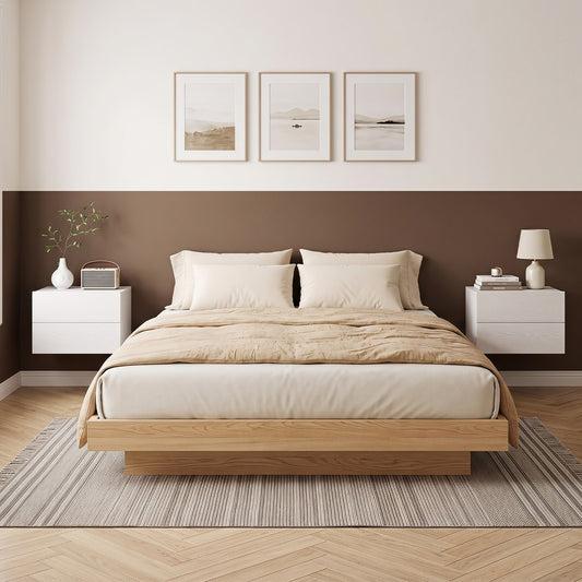 Two white floating nightstands with drawers mounted on a wall either side of a bed