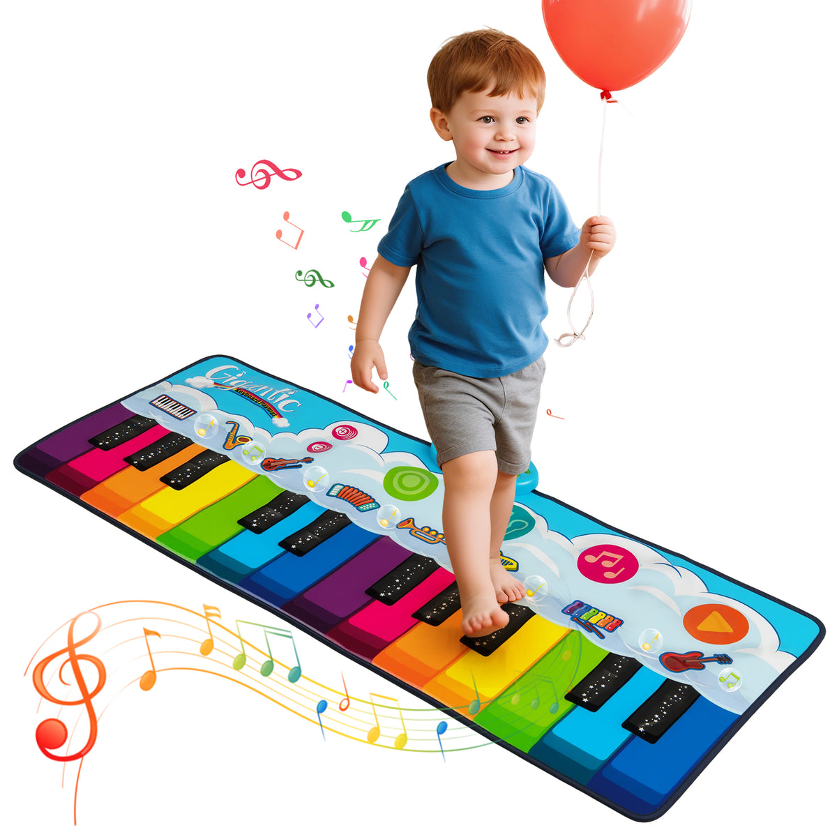 The colourful floor piano being stepped on by a young boy holding a red balloon