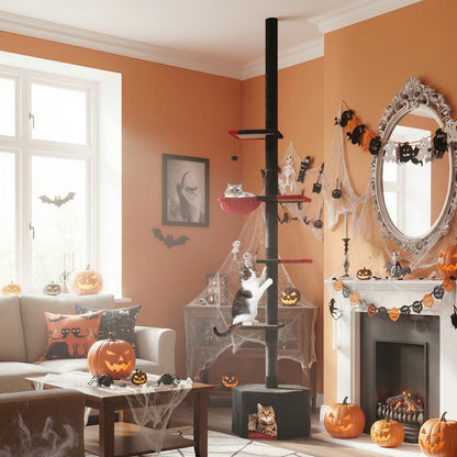A gothic cat tree stands in a living room decorated for Halloween with a fireplace and pumpkins