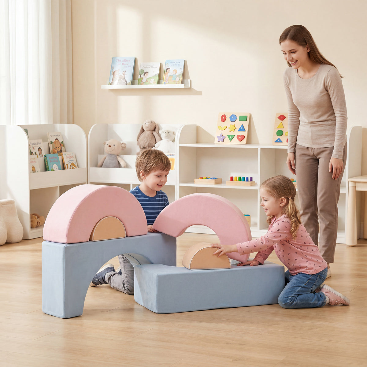 A mother and two children playing with the soft play set in a nursery