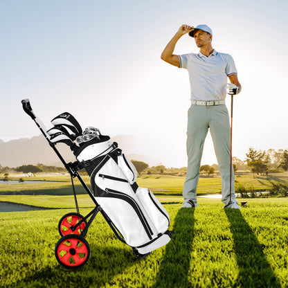 A man in a white shirt stands with the red golf cart and a golf bag on a sunny golf course