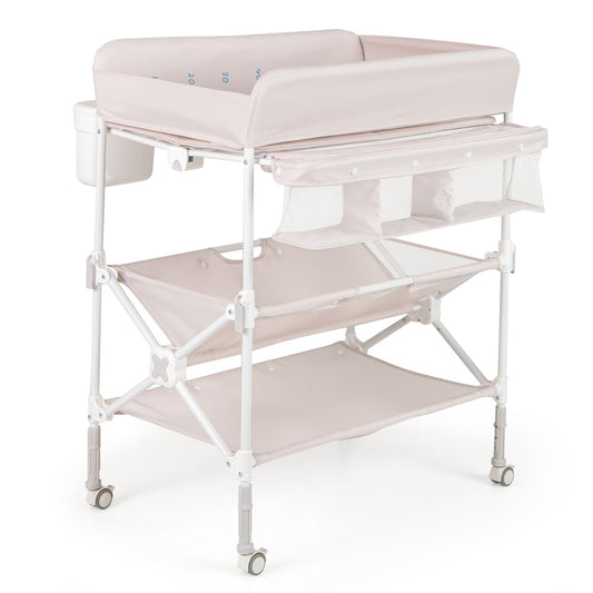 Foldable Baby Changing Table with Wheels and Adjustable Height in light pink, shown from the front with storage shelves