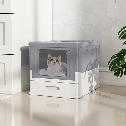 A cat sits inside the enclosed cat toilet, looking up towards the lid