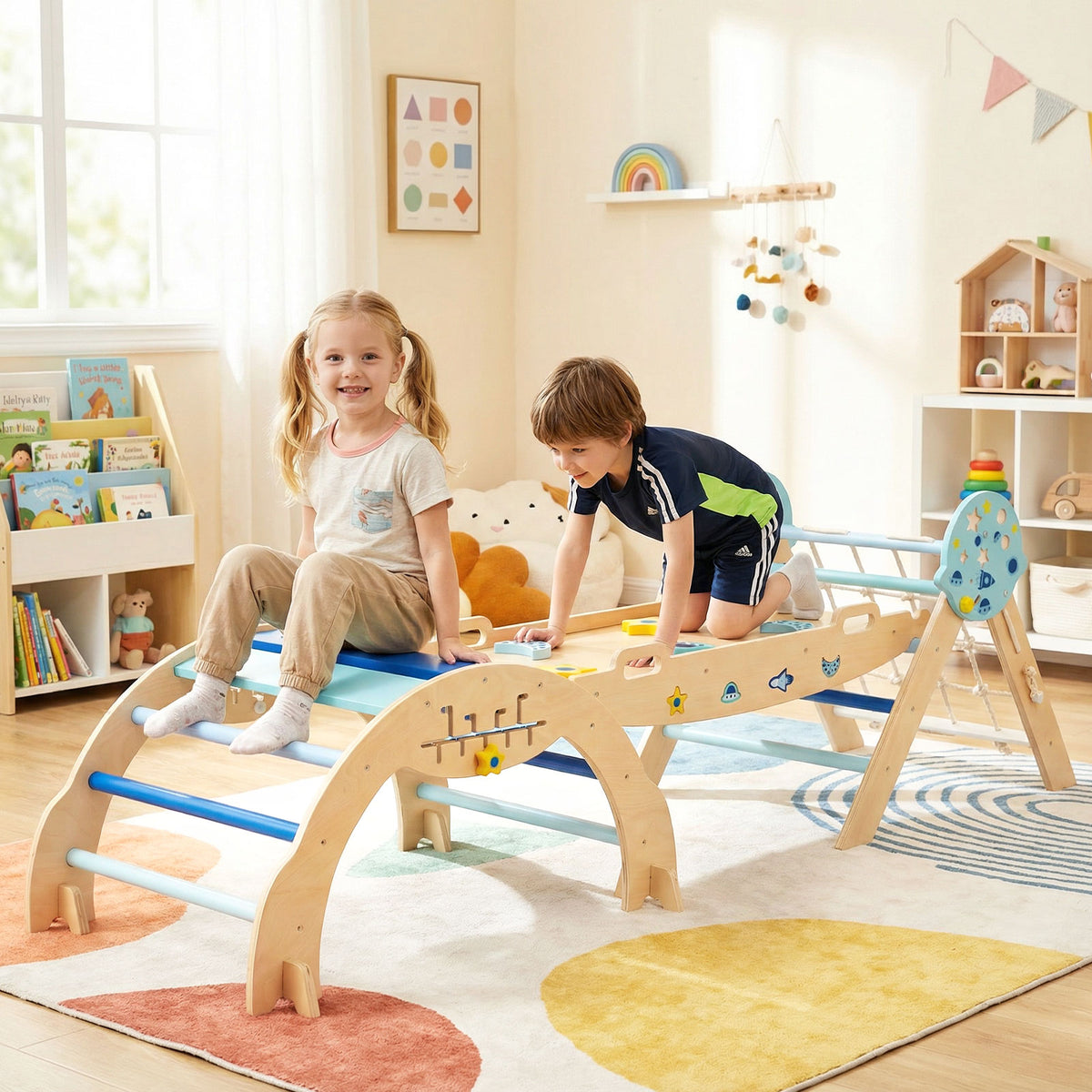 Two toddlers playing on the blue climbing frame in a bright, carpeted room