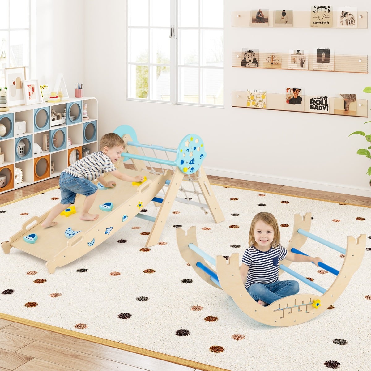 Children enjoying the blue climbing frame and rocker in a playroom setting