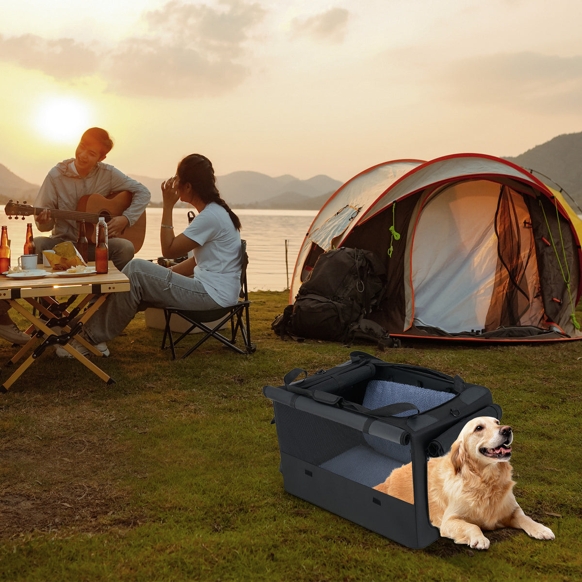 A dog resting in the dog crate at a campsite by a lake with people in the background