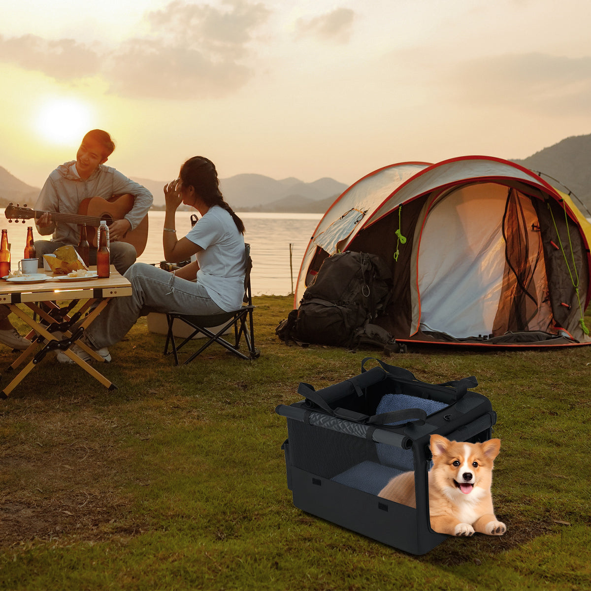 A dog sits in the dog crate at a campsite near a tent and people