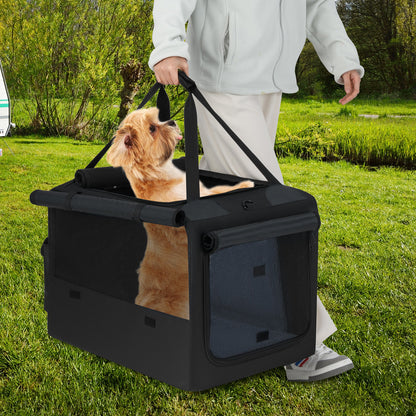 A person carries the dog crate with a dog inside through a grassy field