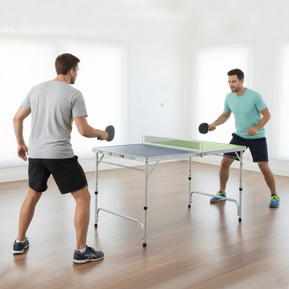 Two men playing table tennis in a bright room with the green and blue table