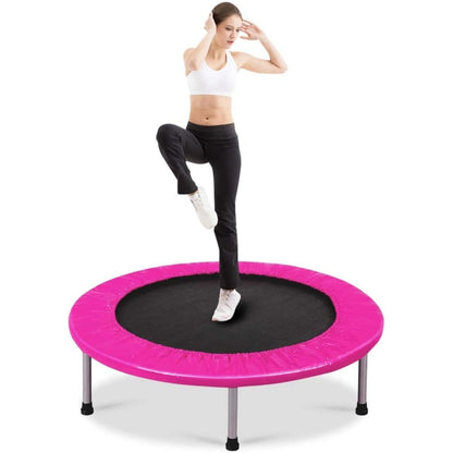 Foldable Mini Trampoline with Springs and Padded Cover-pink with a woman jumping