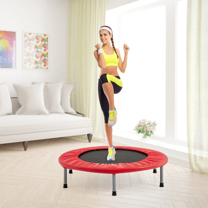 A woman exercising on the red trampoline in a living room