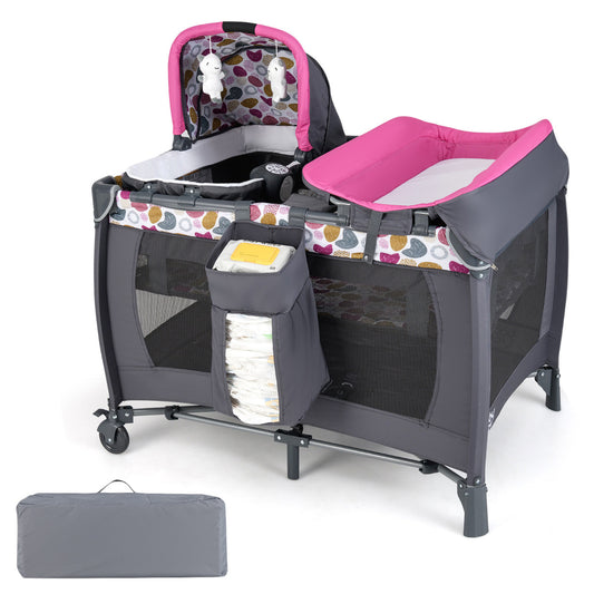 Foldable Pack and Play Portable Baby Playard with rocking bassinet and diaper changing table in pink