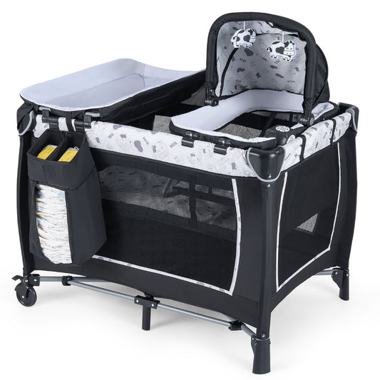 Foldable Pack and Play Portable Baby Playard with a changing table and a rocking bassinet attached