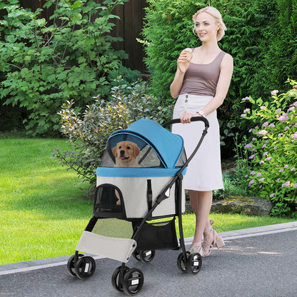 The dog stroller being pushed by a woman in a garden with a puppy inside
