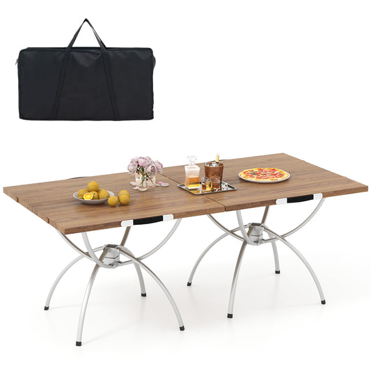 Foldable Picnic Table set up with food and drinks alongside its black storage bag