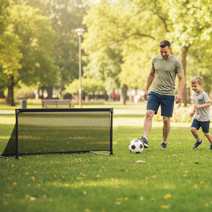 Father and son playing football with the pop-up soccer goal in a park