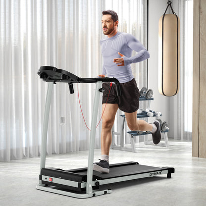 The treadmill in use by a man in a home gym setting with a punching bag in the background
