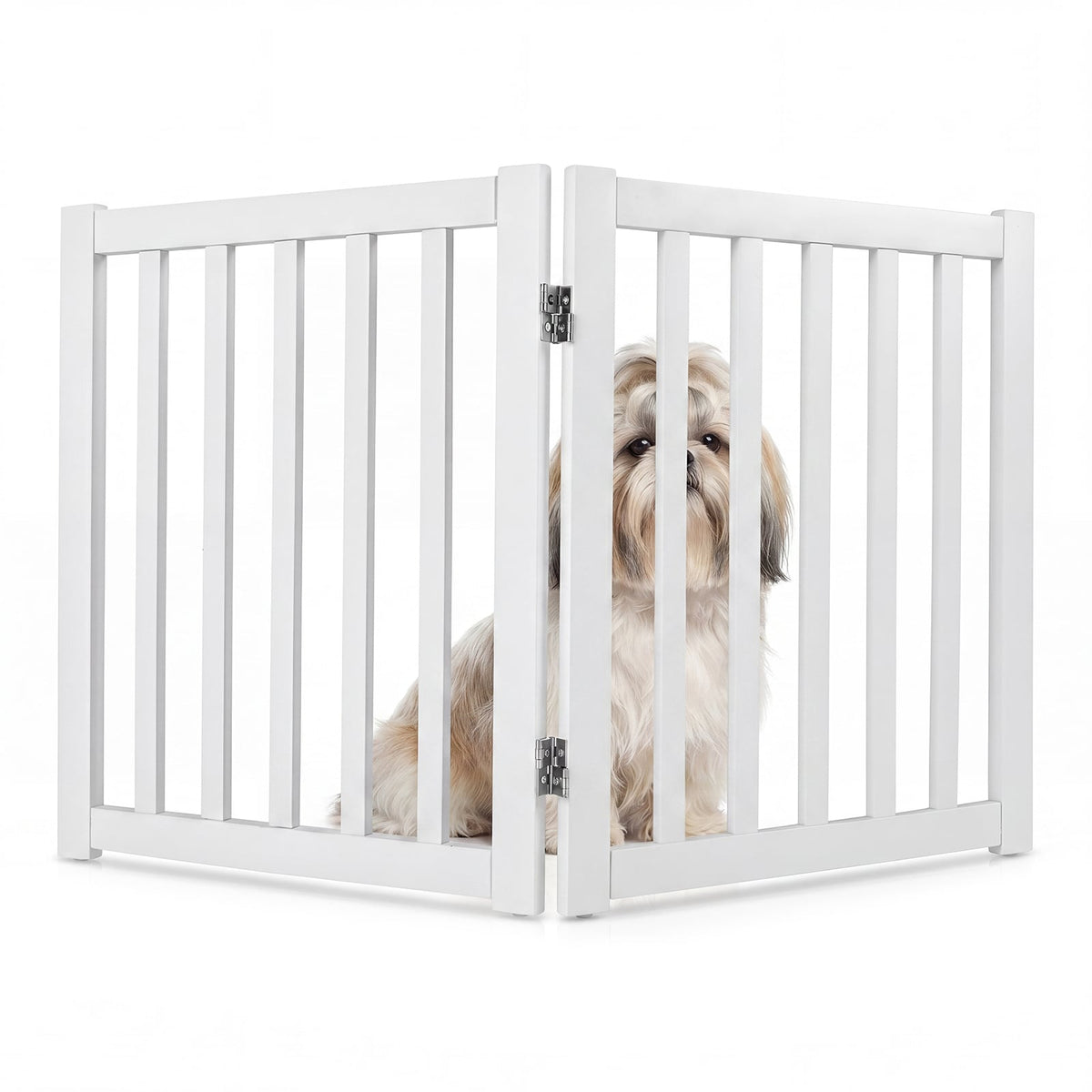 A shih tzu peeks through the white wooden pet gate, which is set up in an open doorway