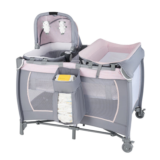 The portable baby playard featuring a pink and grey canopy with hanging toys and a changing table