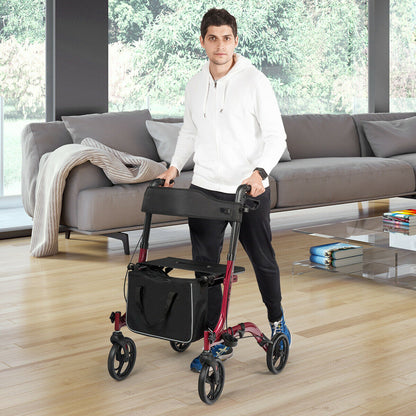 A man stands with the red four-wheeled walker in a modern living room