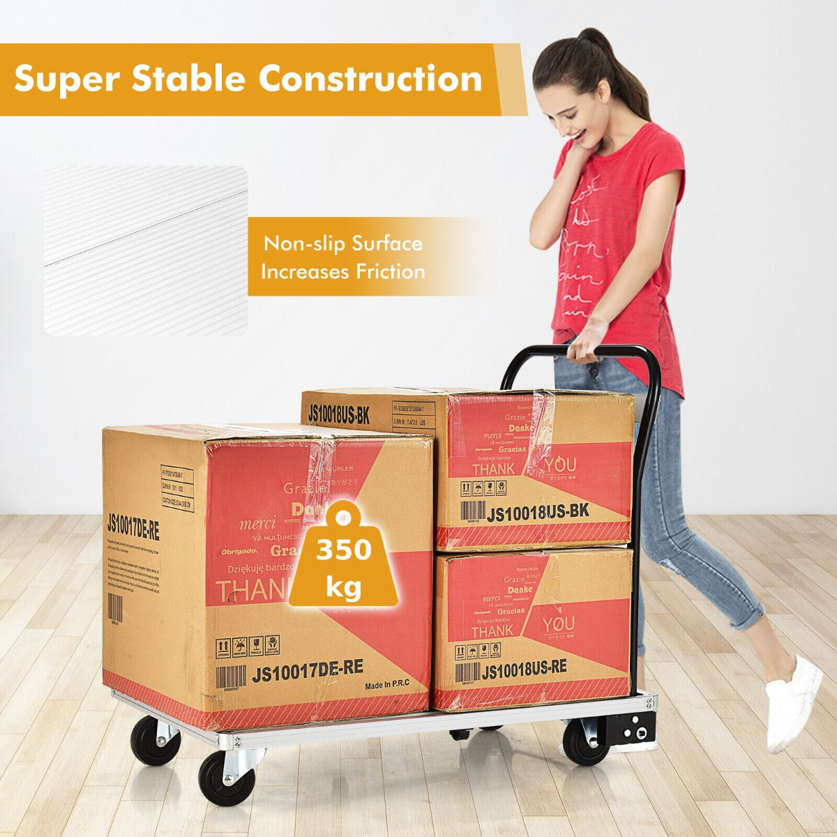A woman pushing the aluminium platform truck loaded with boxes, showing its load capacity
