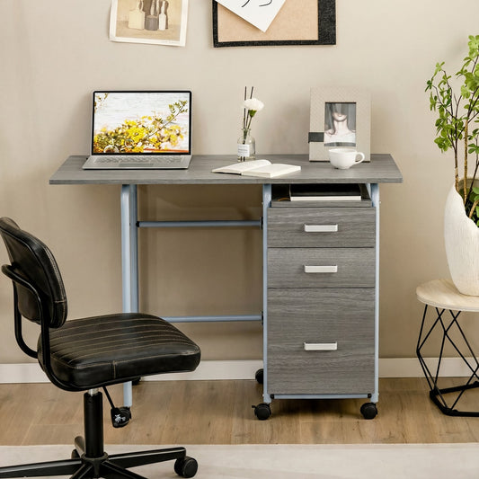 The office desk with drawers is set up in a home office next to a chair