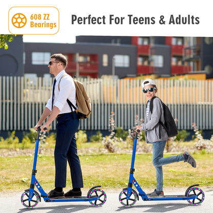 A man and a boy ride blue kick scooters outdoors