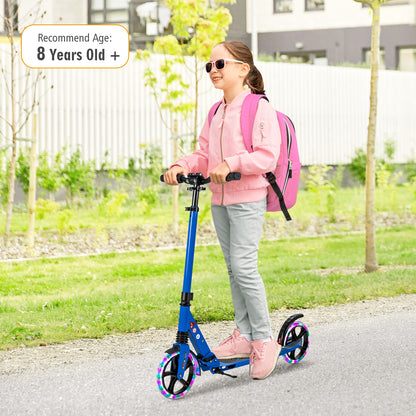 A girl with a pink backpack rides the blue kick scooter on a path